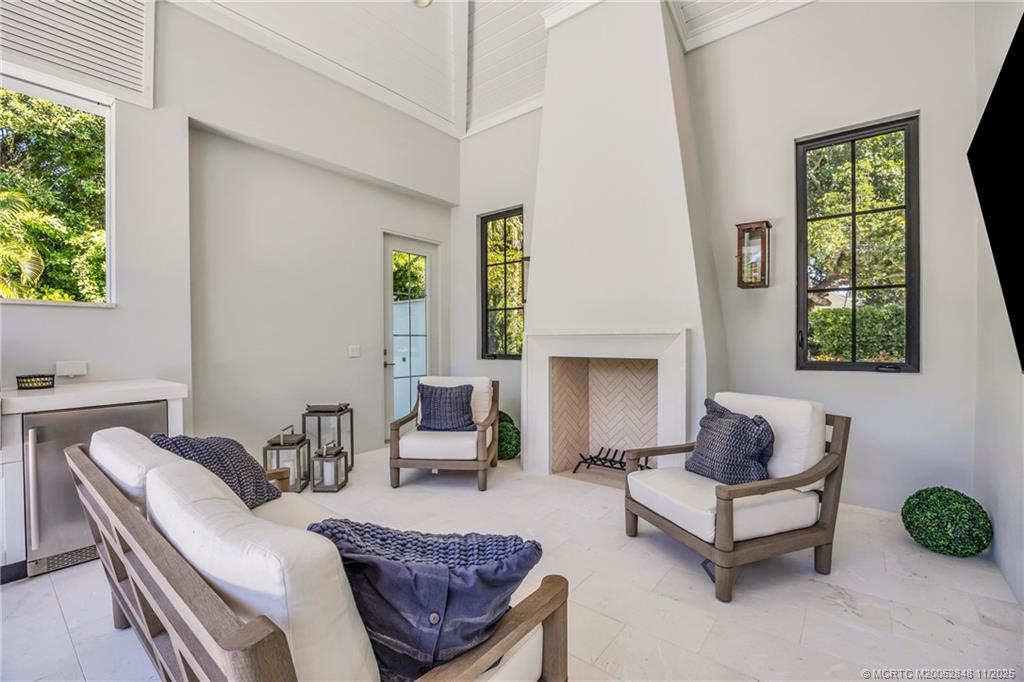 44 South Beach Road Hobe Sound, FL 33455 - Photo 70 of 73 a living room with furniture and a window
