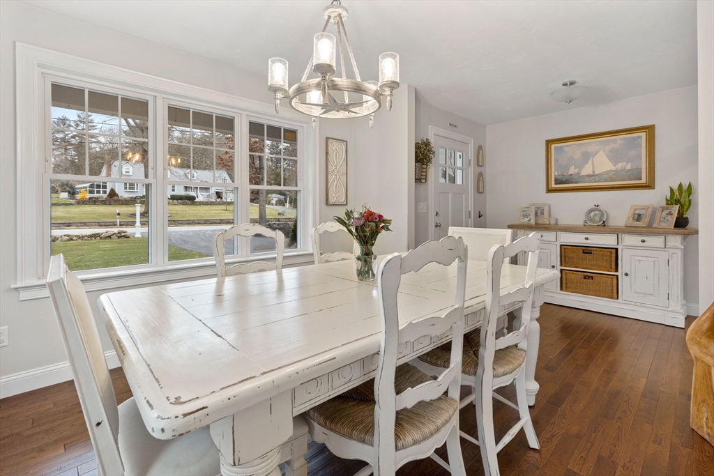 732 Center Street Hanover, MA 02339 - Photo 11 of 38 a view of a dining room with furniture wooden floor and chandelier