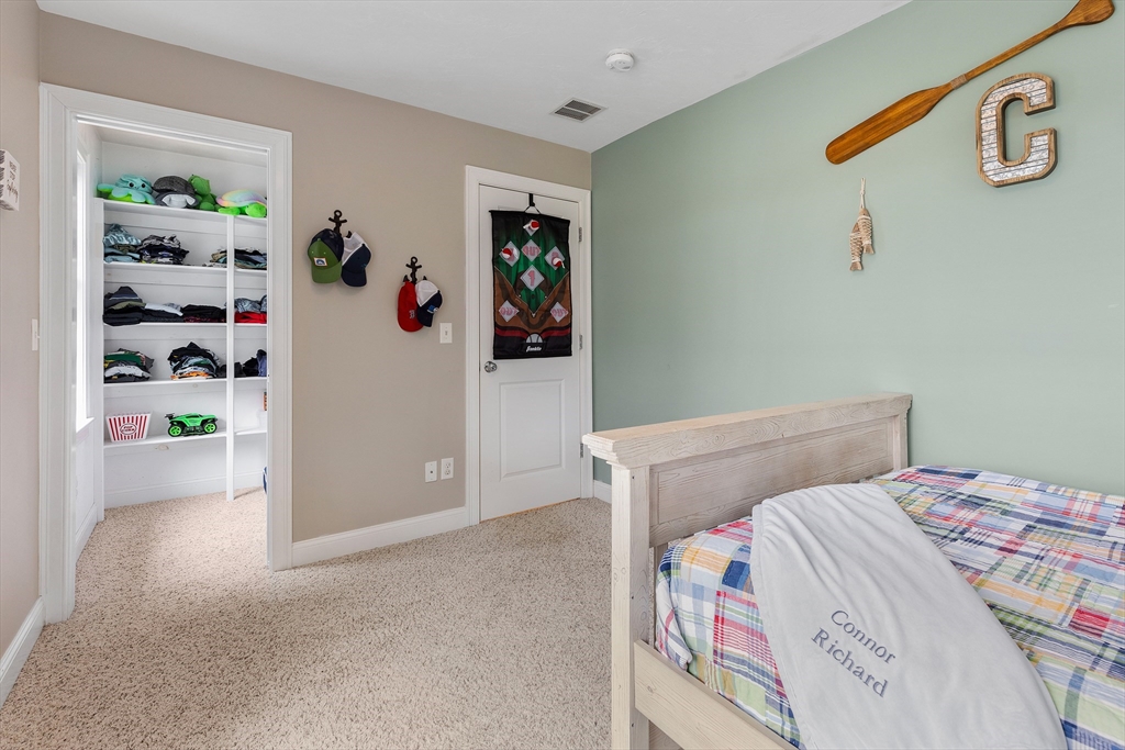 732 Center Street Hanover, MA 02339 - Photo 20 of 38 a bedroom with a bed and closet