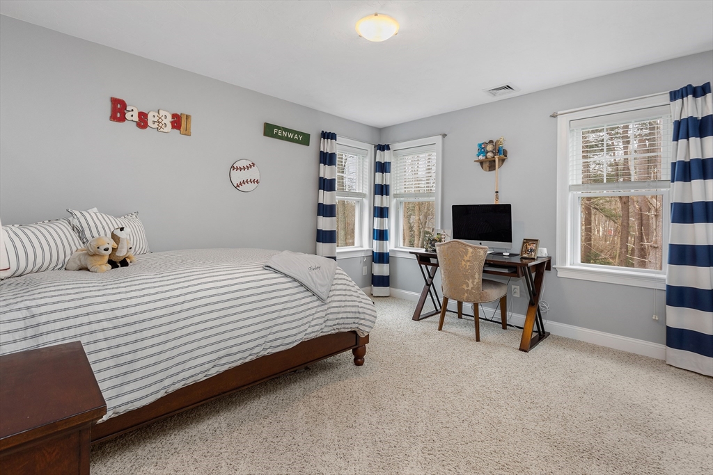 732 Center Street Hanover, MA 02339 - Photo 21 of 38 a bedroom with a bed and a desk