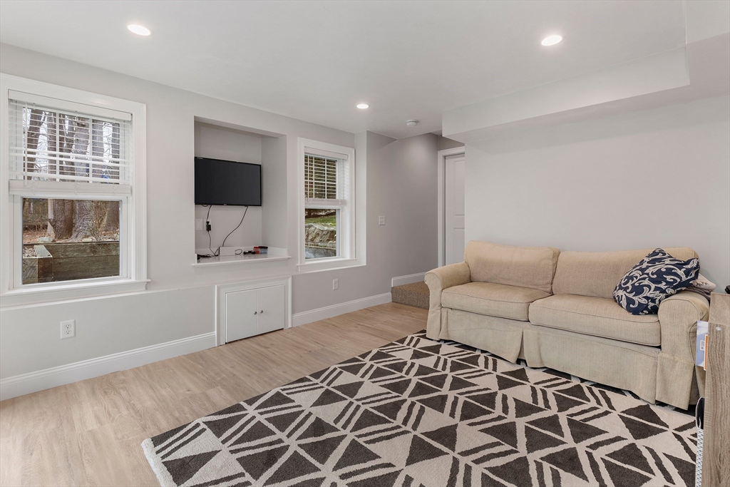 732 Center Street Hanover, MA 02339 - Photo 27 of 38 a living room with furniture and a flat screen tv