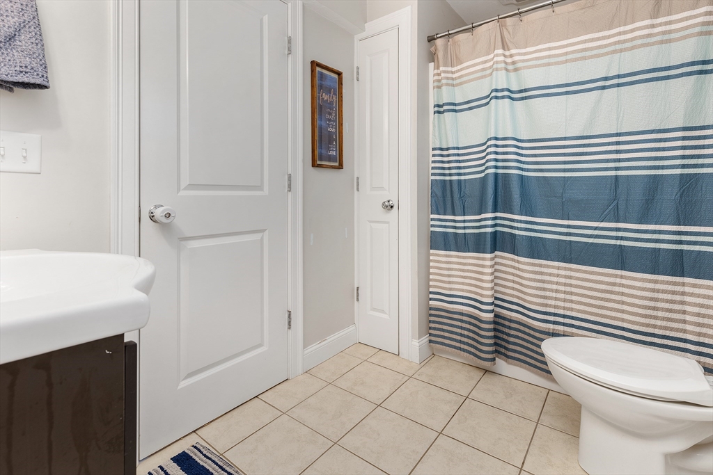 732 Center Street Hanover, MA 02339 - Photo 28 of 38 a bathroom with a sink a toilet and shower