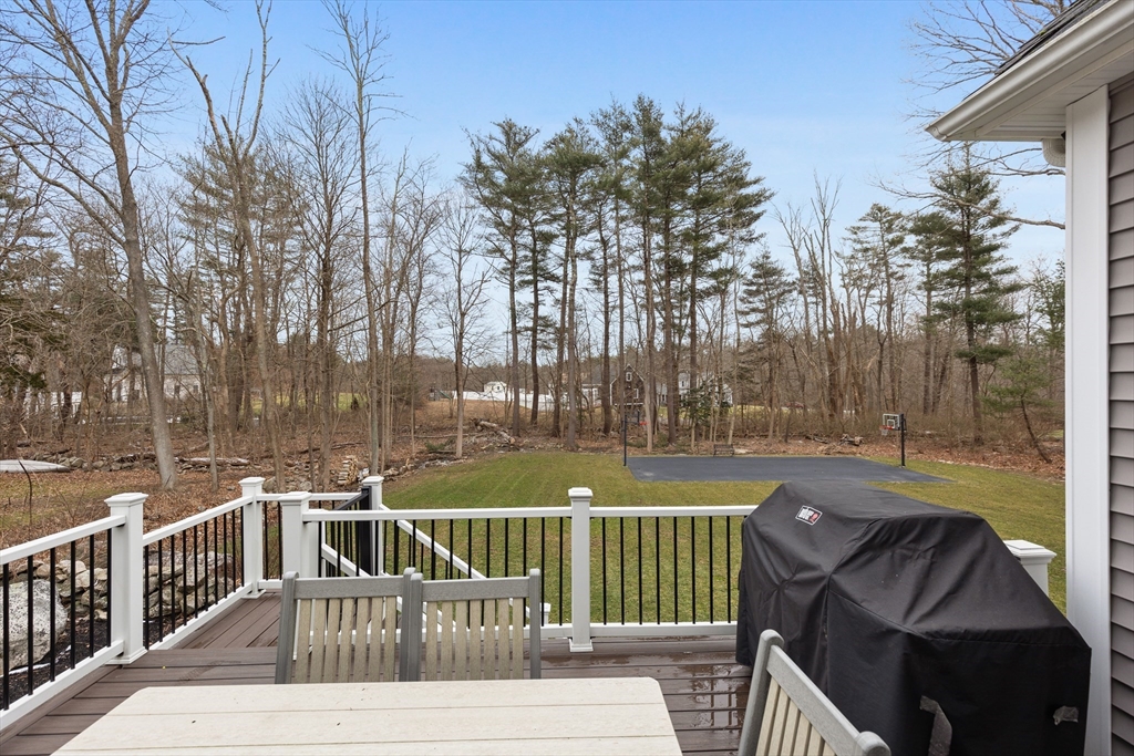 732 Center Street Hanover, MA 02339 - Photo 33 of 38 a view of a patio with couches table and chairs and wooden floor