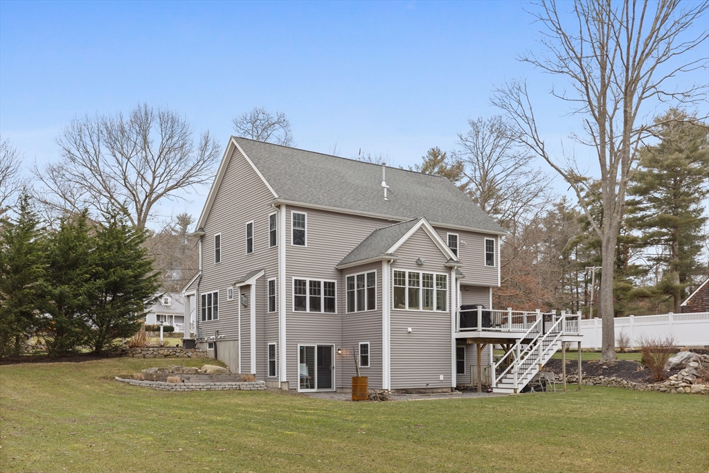 732 Center Street Hanover, MA 02339 - Photo 36 of 38 a view of a white house with a big yard and large trees