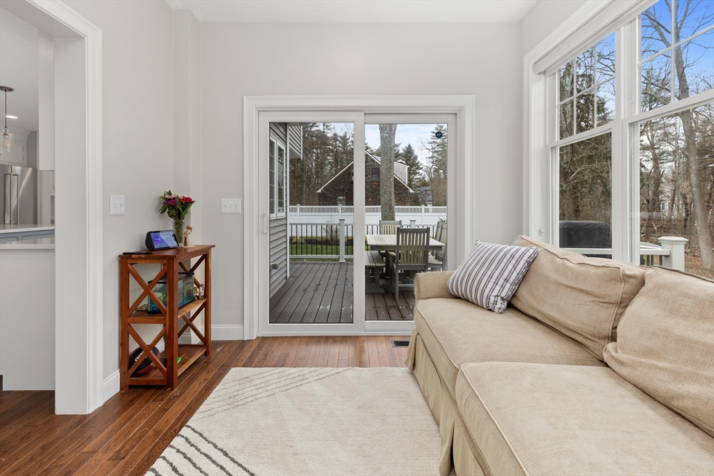 732 Center Street Hanover, MA 02339 - Photo 9 of 38 a living room with furniture and a large window