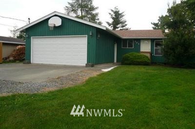 501 Mission Road Everson, WA 98247 - Photo 1 of 1 a front view of a house with a garden