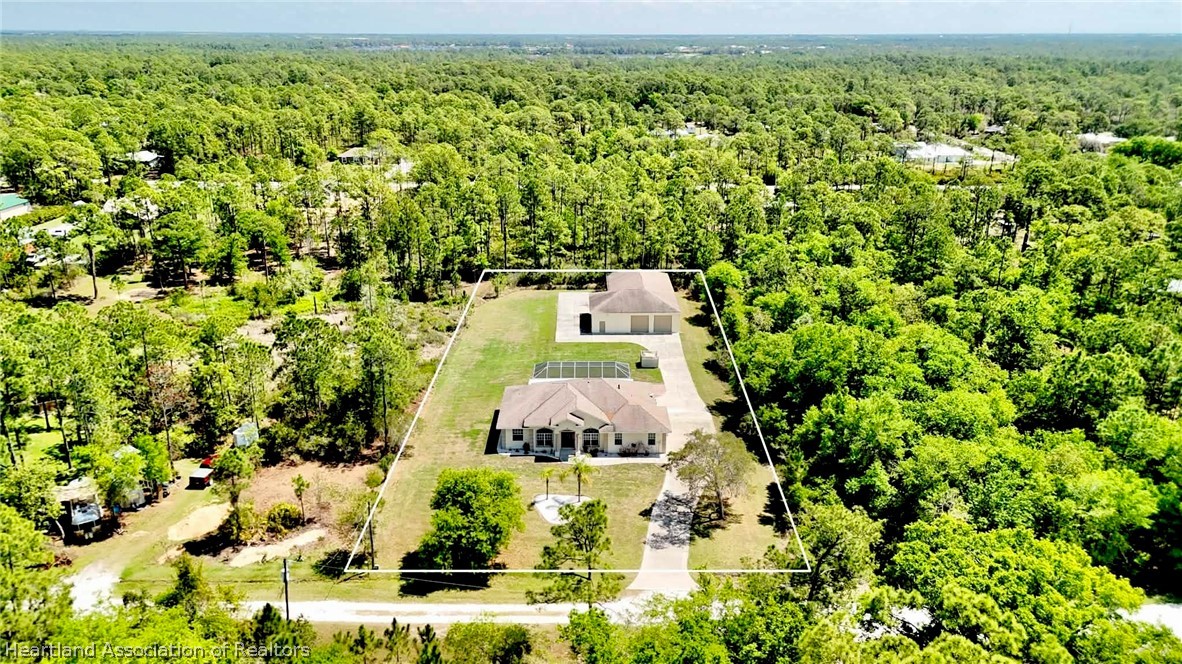 6032 Elm Road Sebring, FL 33875 - Photo 2 of 47 an aerial view of residential houses with yard