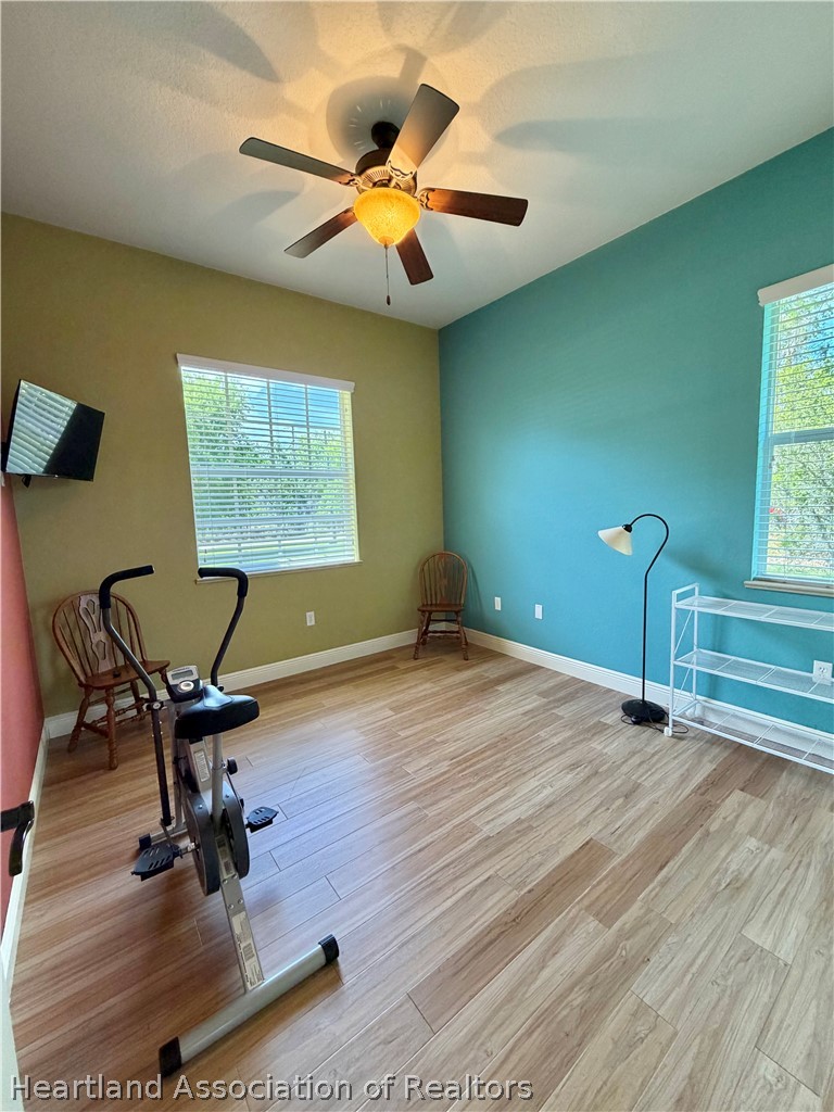 6032 Elm Road Sebring, FL 33875 - Photo 21 of 47 a view of a workspace with furniture and a window