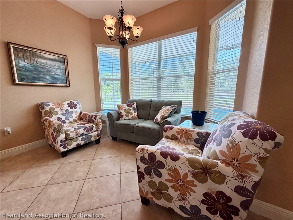6032 Elm Road Sebring, FL 33875 - Photo 25 of 47 a bedroom with furniture and a window
