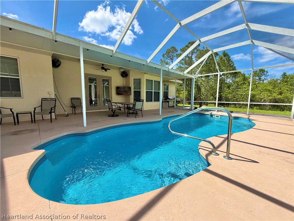 6032 Elm Road Sebring, FL 33875 - Photo 26 of 47 a view of a swimming pool with a patio