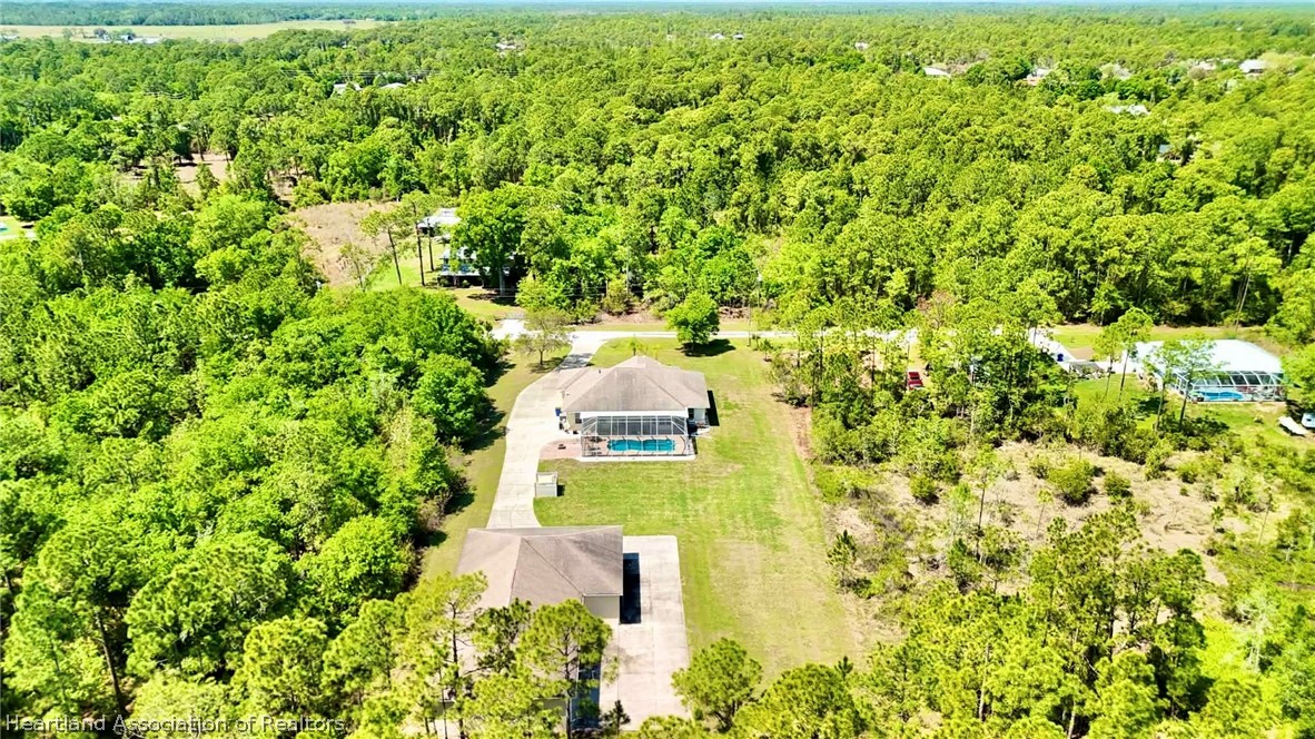 6032 Elm Road Sebring, FL 33875 - Photo 28 of 47 a view of a yard with plants