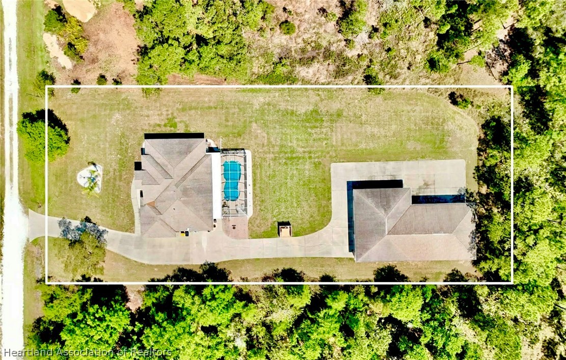 6032 Elm Road Sebring, FL 33875 - Photo 3 of 47 an aerial view of residential house with outdoor space