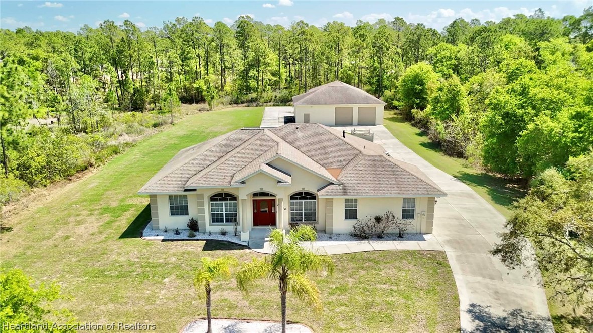 6032 Elm Road Sebring, FL 33875 - Photo 33 of 47 a view of house with garden