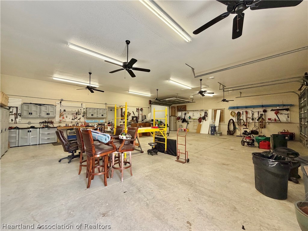 6032 Elm Road Sebring, FL 33875 - Photo 43 of 47 a view of a storage room with a table and chairs