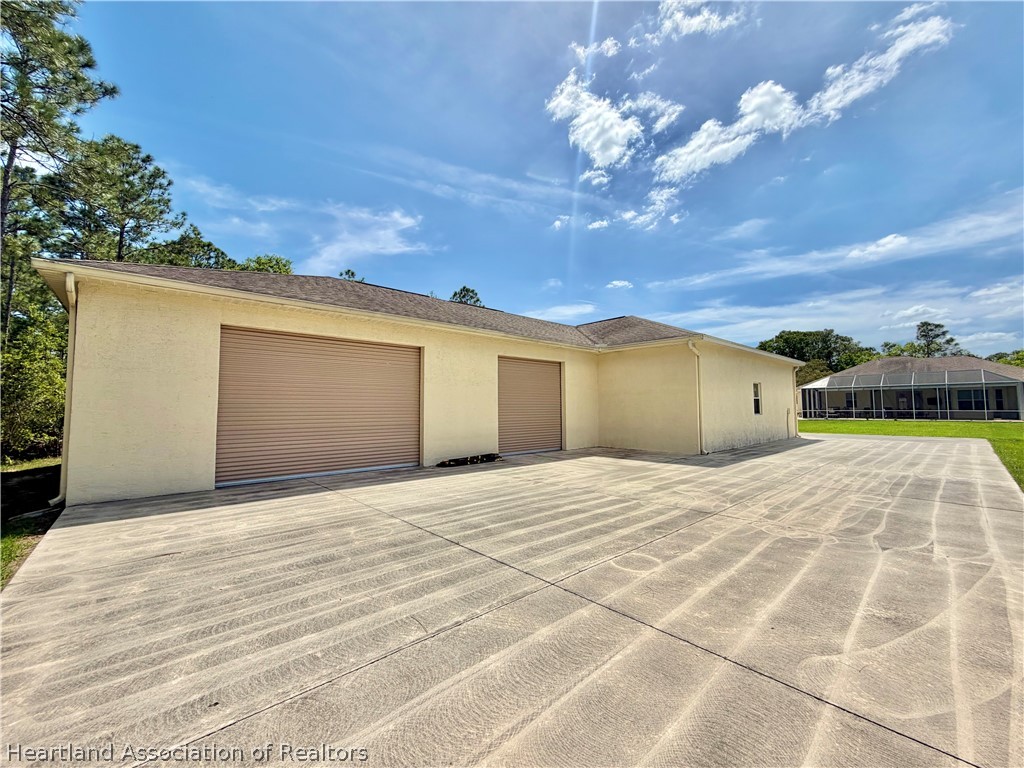 6032 Elm Road Sebring, FL 33875 - Photo 44 of 47 a view of empty room with a garage