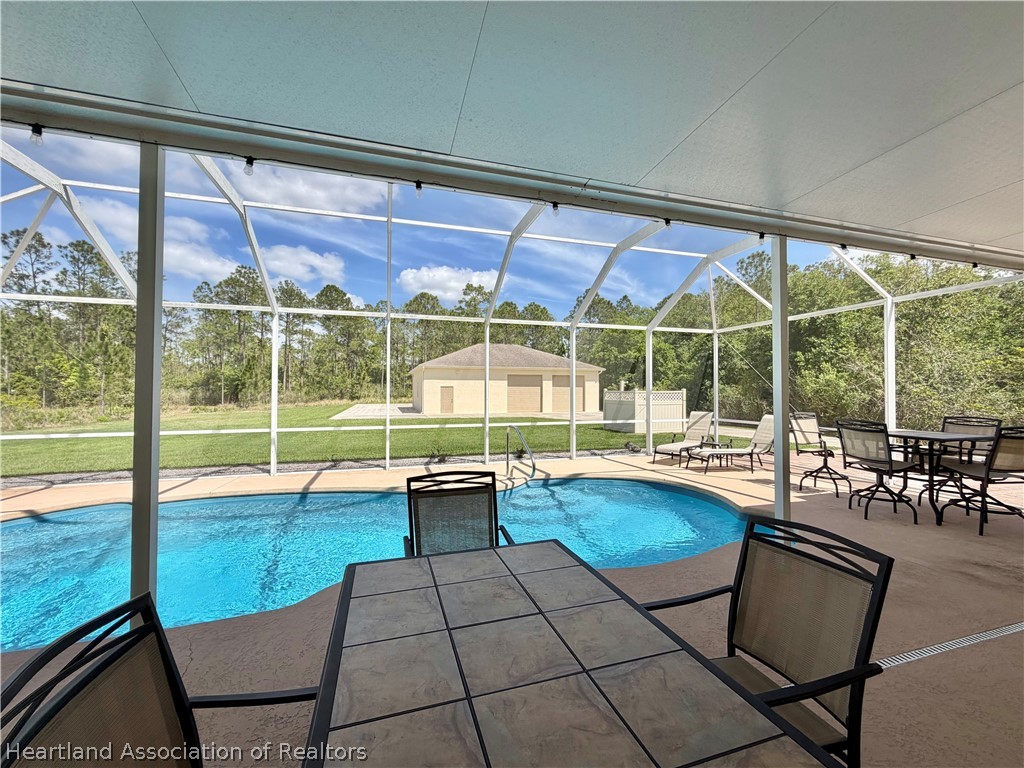 6032 Elm Road Sebring, FL 33875 - Photo 45 of 47 a view of swimming pool with outdoor seating
