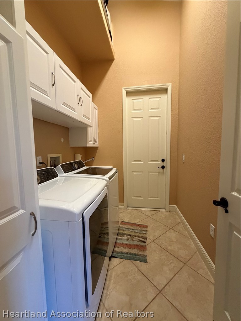 6032 Elm Road Sebring, FL 33875 - Photo 47 of 47 a kitchen with a sink a refrigerator and cabinets
