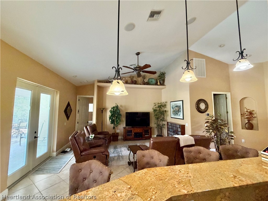 6032 Elm Road Sebring, FL 33875 - Photo 7 of 47 a living room with fireplace furniture and a flat screen tv