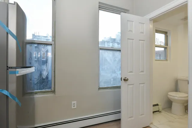 a view of a bathroom with toilet