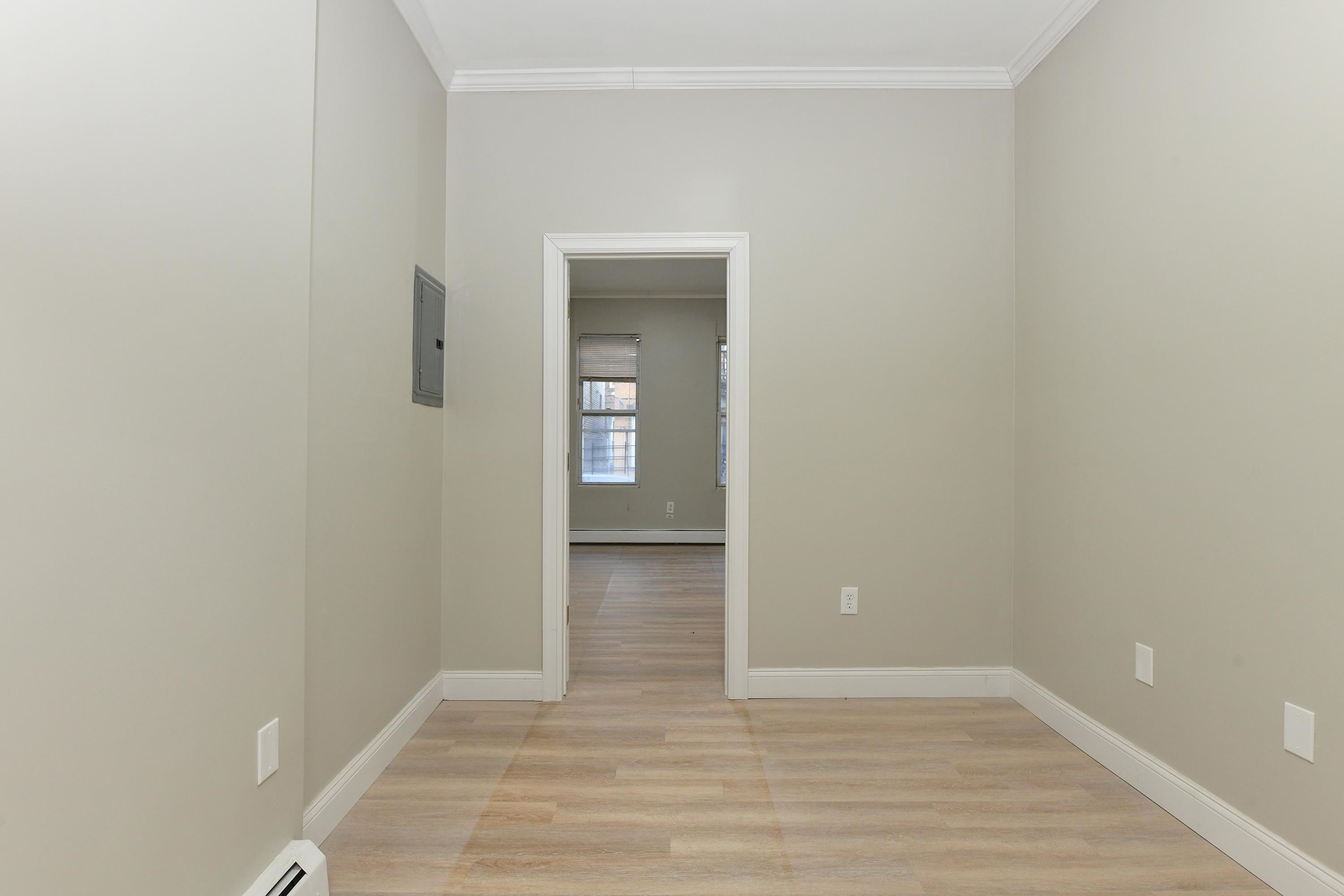 531 28th Street, Unit 2 Union City, NJ 07087 - Photo 18 of 25 an empty room with wooden floor and closet