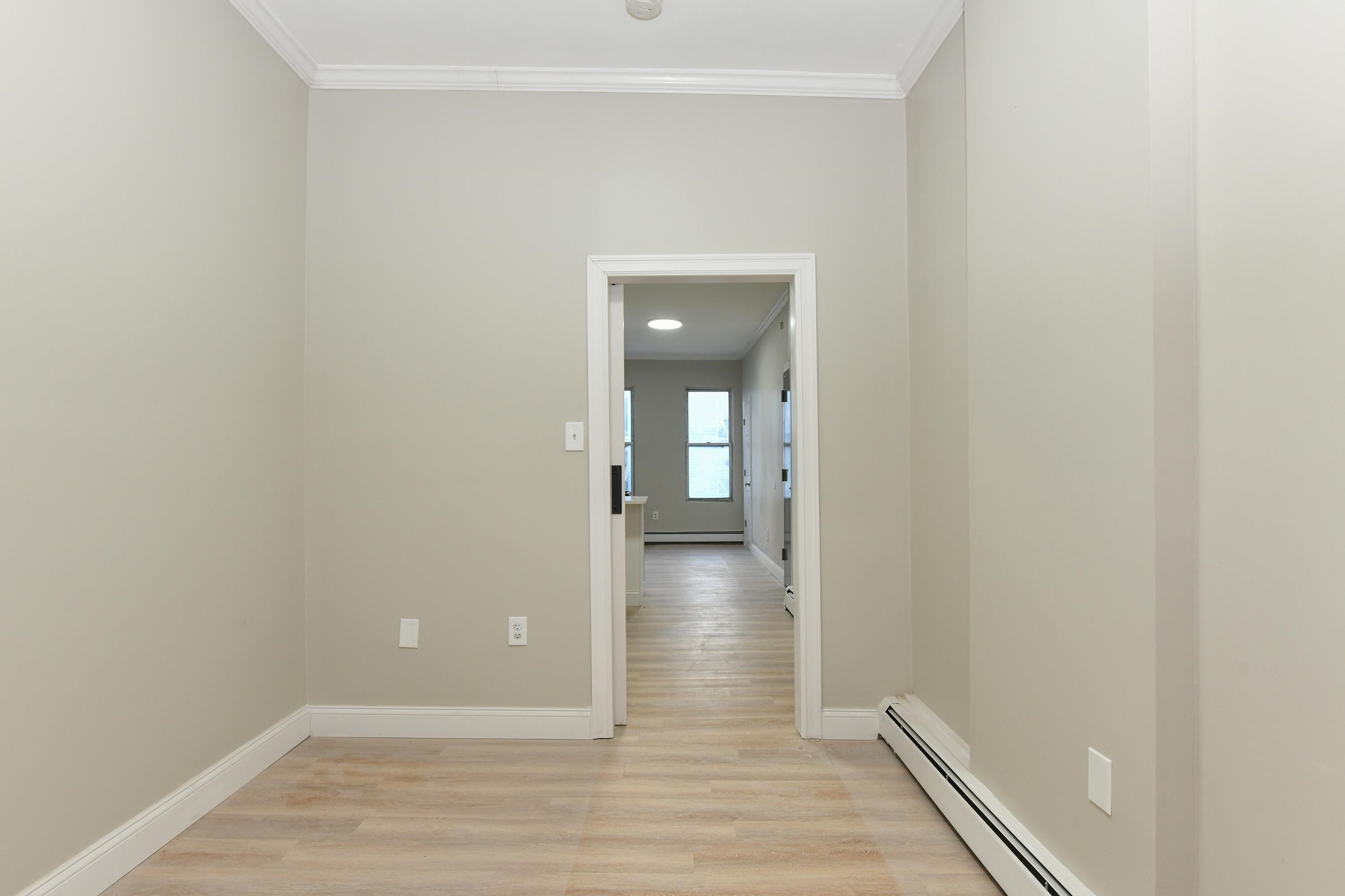 531 28th Street, Unit 2 Union City, NJ 07087 - Photo 19 of 25 a view of a hallway with wooden floor