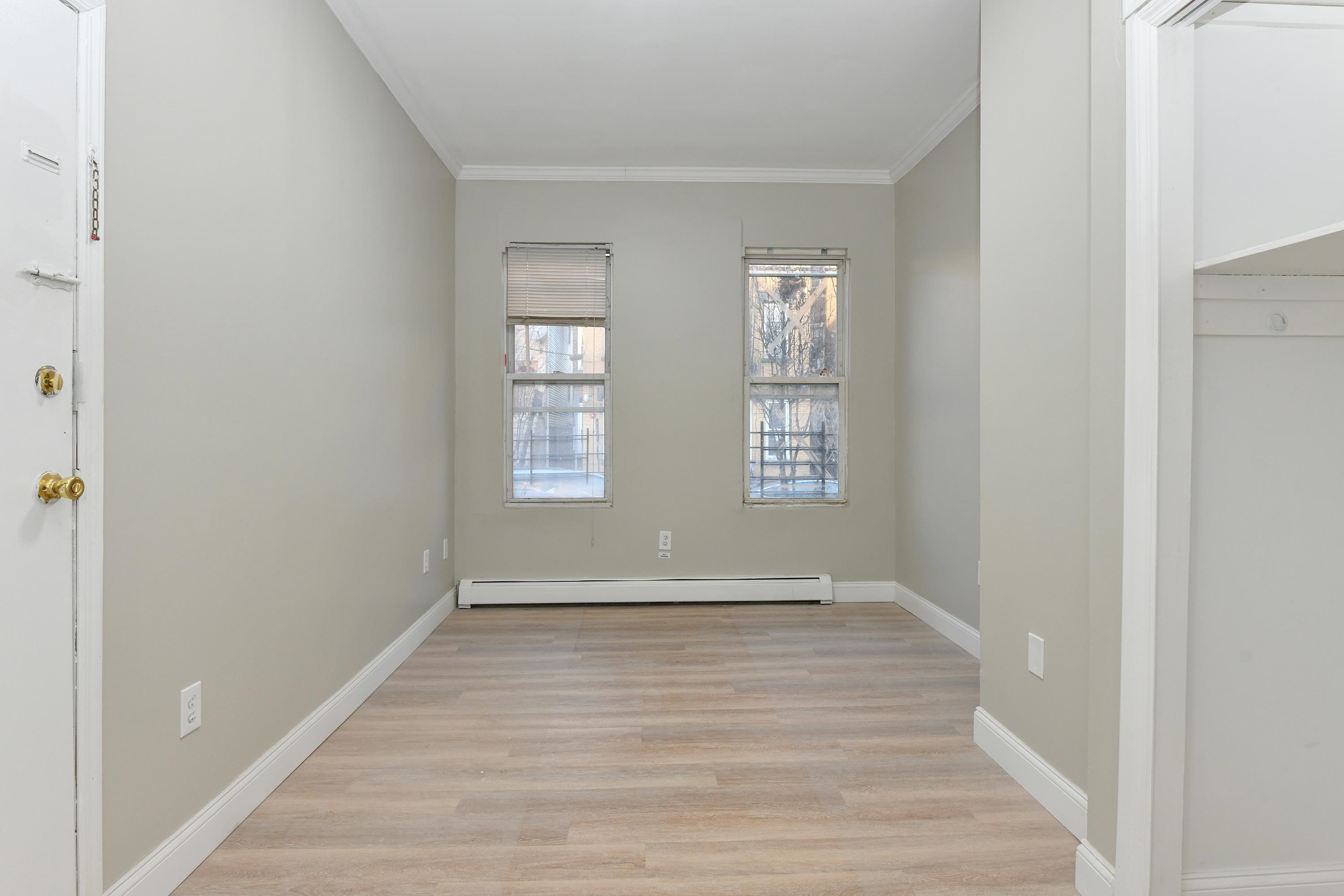 531 28th Street, Unit 2 Union City, NJ 07087 - Photo 20 of 25 a view of room with window and hardwood floor