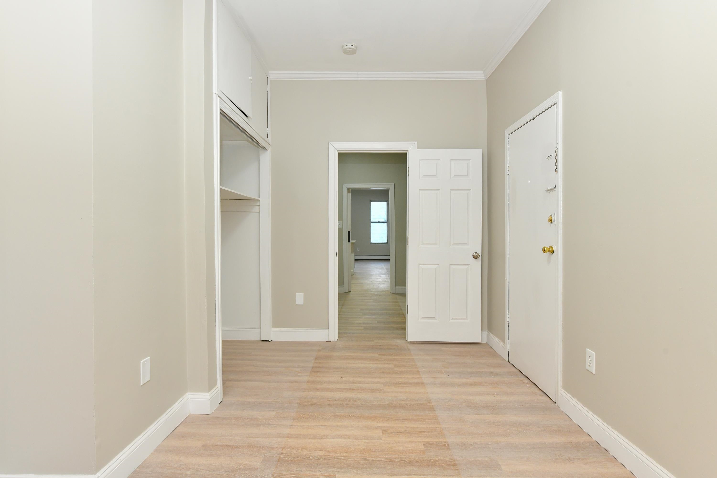 531 28th Street, Unit 2 Union City, NJ 07087 - Photo 21 of 25 an empty room with wooden floor & windows