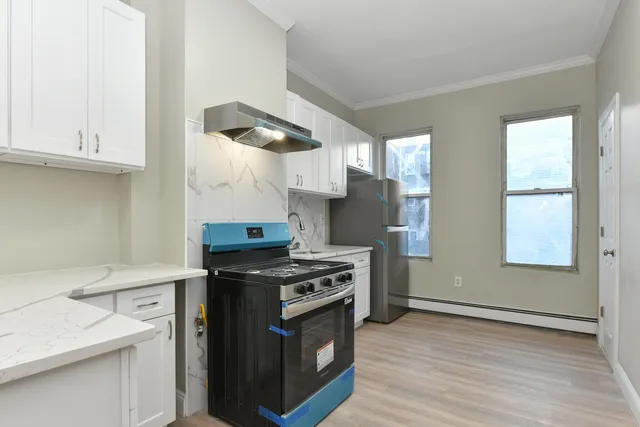 a kitchen with a stove and a sink