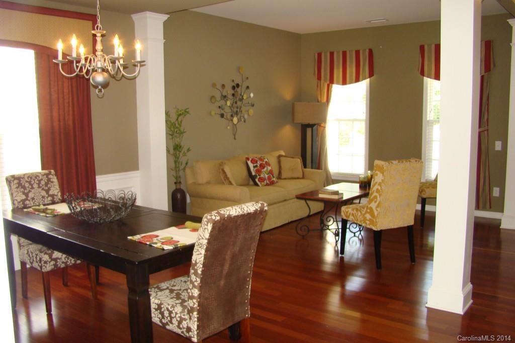 2204 Coltsgate Road Waxhaw, NC 28173 - Photo 2 of 15 a view of a dining room with furniture and wooden floor