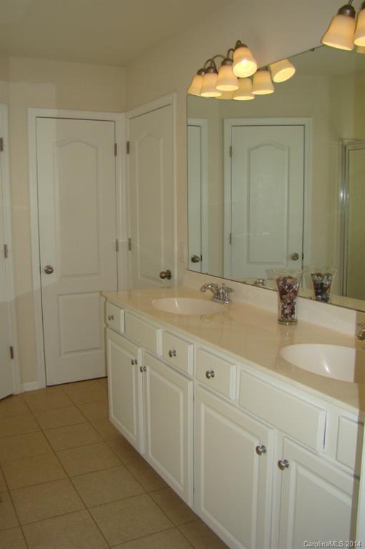 2204 Coltsgate Road Waxhaw, NC 28173 - Photo 12 of 15 a bathroom with a double vanity sink and a mirror