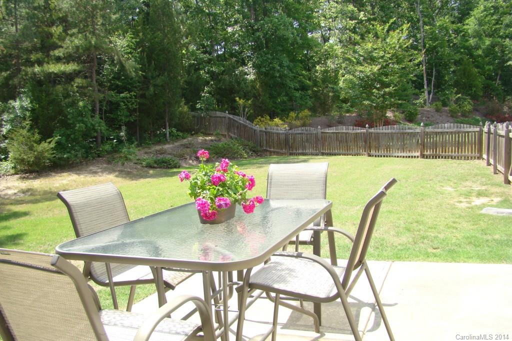 2204 Coltsgate Road Waxhaw, NC 28173 - Photo 14 of 15 a view of a dining room with furniture and a backyard