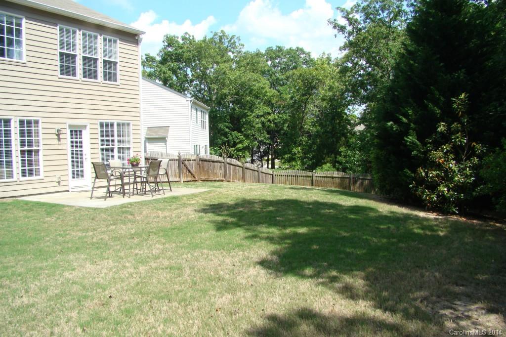 2204 Coltsgate Road Waxhaw, NC 28173 - Photo 15 of 15 a view of a house with a backyard and a garden