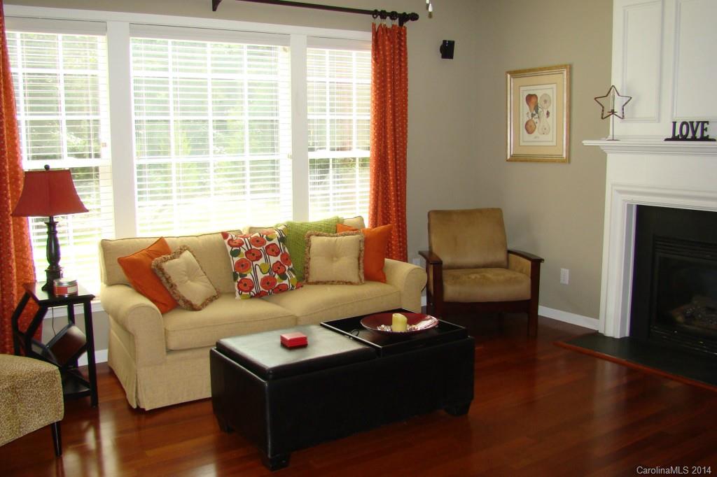 2204 Coltsgate Road Waxhaw, NC 28173 - Photo 7 of 15 a living room with furniture and a fireplace