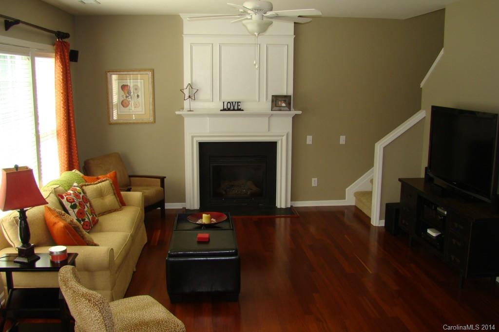 2204 Coltsgate Road Waxhaw, NC 28173 - Photo 8 of 15 a living room with furniture and a fireplace