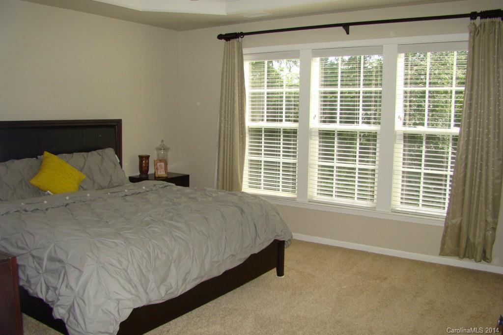 2204 Coltsgate Road Waxhaw, NC 28173 - Photo 10 of 15 a bedroom with a bed and window