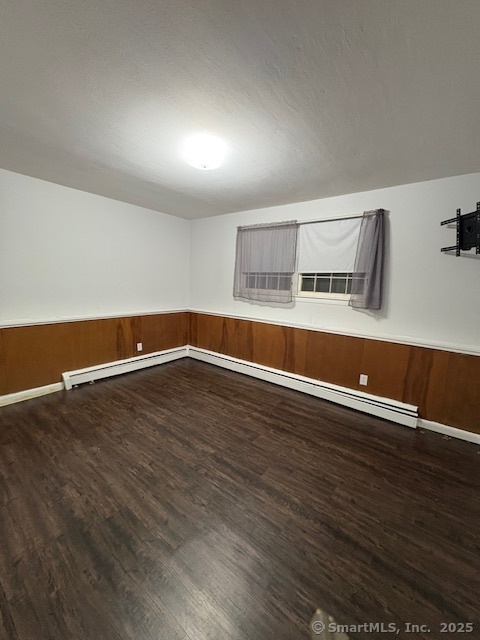 26 Lamphere Road Waterford, CT 06385 - Photo 11 of 14 an empty room with wooden floor and windows