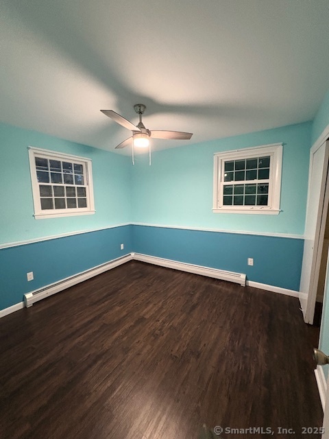 26 Lamphere Road Waterford, CT 06385 - Photo 13 of 14 an empty room with wooden floor and windows