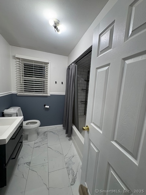 26 Lamphere Road Waterford, CT 06385 - Photo 7 of 14 a bathroom with a granite countertop sink a toilet a mirror and shower