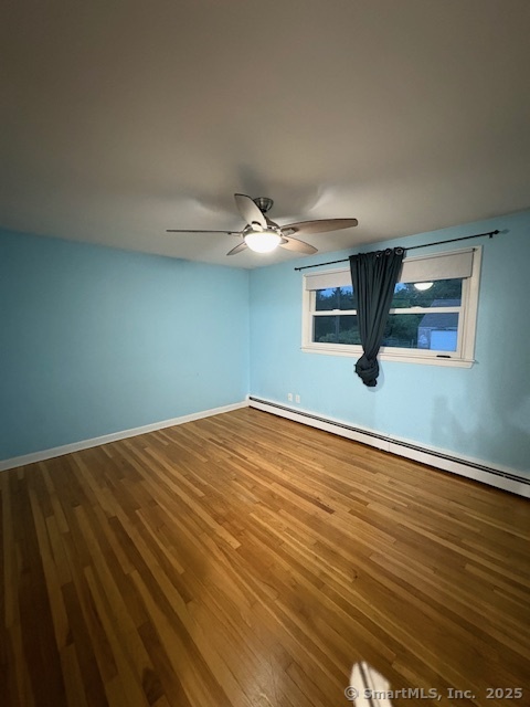 26 Lamphere Road Waterford, CT 06385 - Photo 8 of 14 a view of a room with wooden floor and white walls