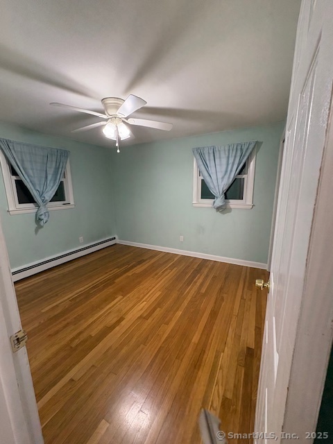 26 Lamphere Road Waterford, CT 06385 - Photo 10 of 14 a view of a room with wooden floor and ceiling fan