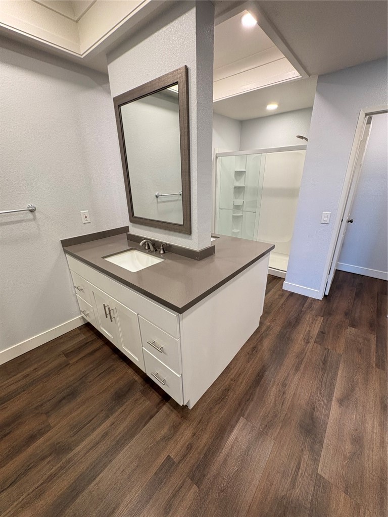 7 Rainbow, Unit 4 Irvine, CA 92603 - Photo 16 of 31 a bathroom with a granite countertop sink and mirror