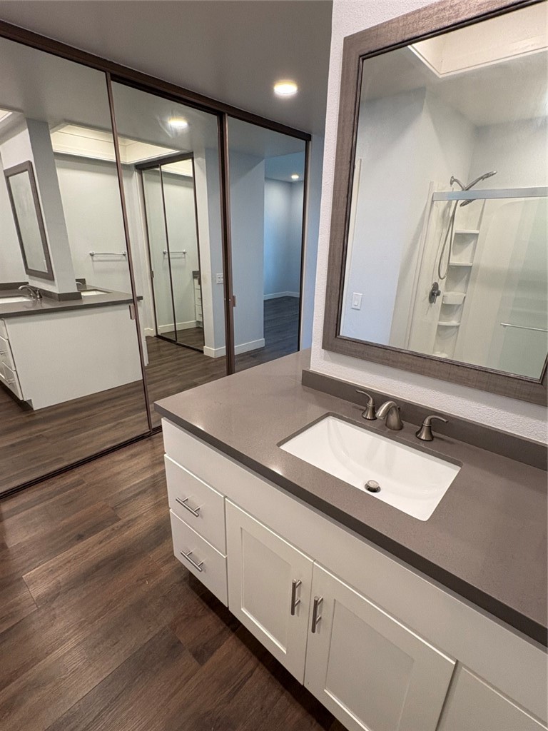 7 Rainbow, Unit 4 Irvine, CA 92603 - Photo 19 of 31 a bathroom with a sink and a mirror