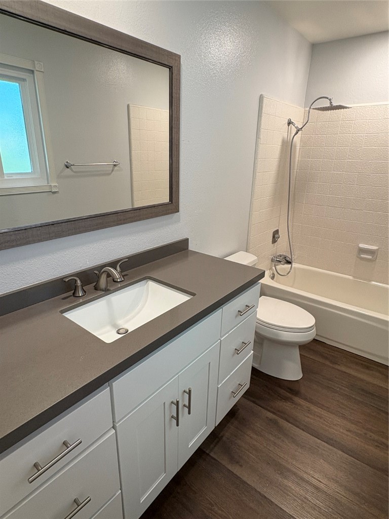 7 Rainbow, Unit 4 Irvine, CA 92603 - Photo 23 of 31 a bathroom with a double vanity sink toilet and shower