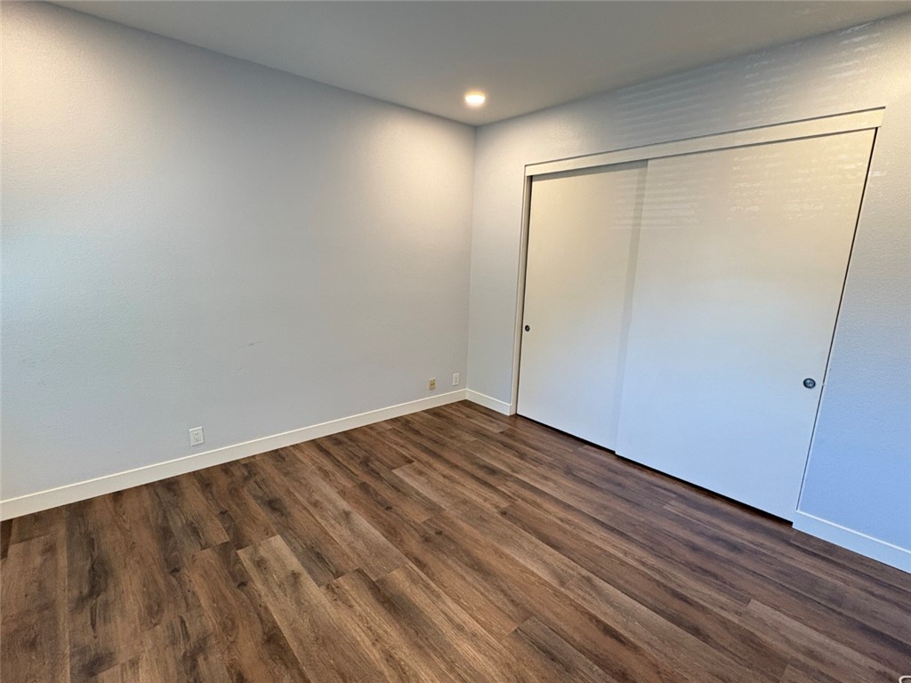 7 Rainbow, Unit 4 Irvine, CA 92603 - Photo 24 of 31 a view of an empty room with wooden floor