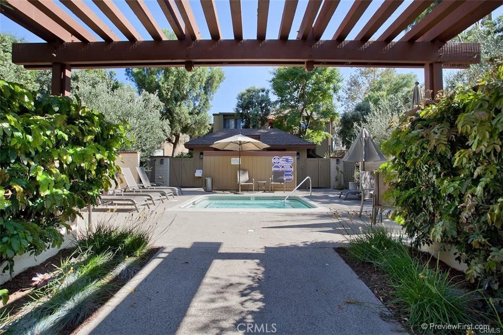 7 Rainbow, Unit 4 Irvine, CA 92603 - Photo 31 of 31 a front view of a house with garden