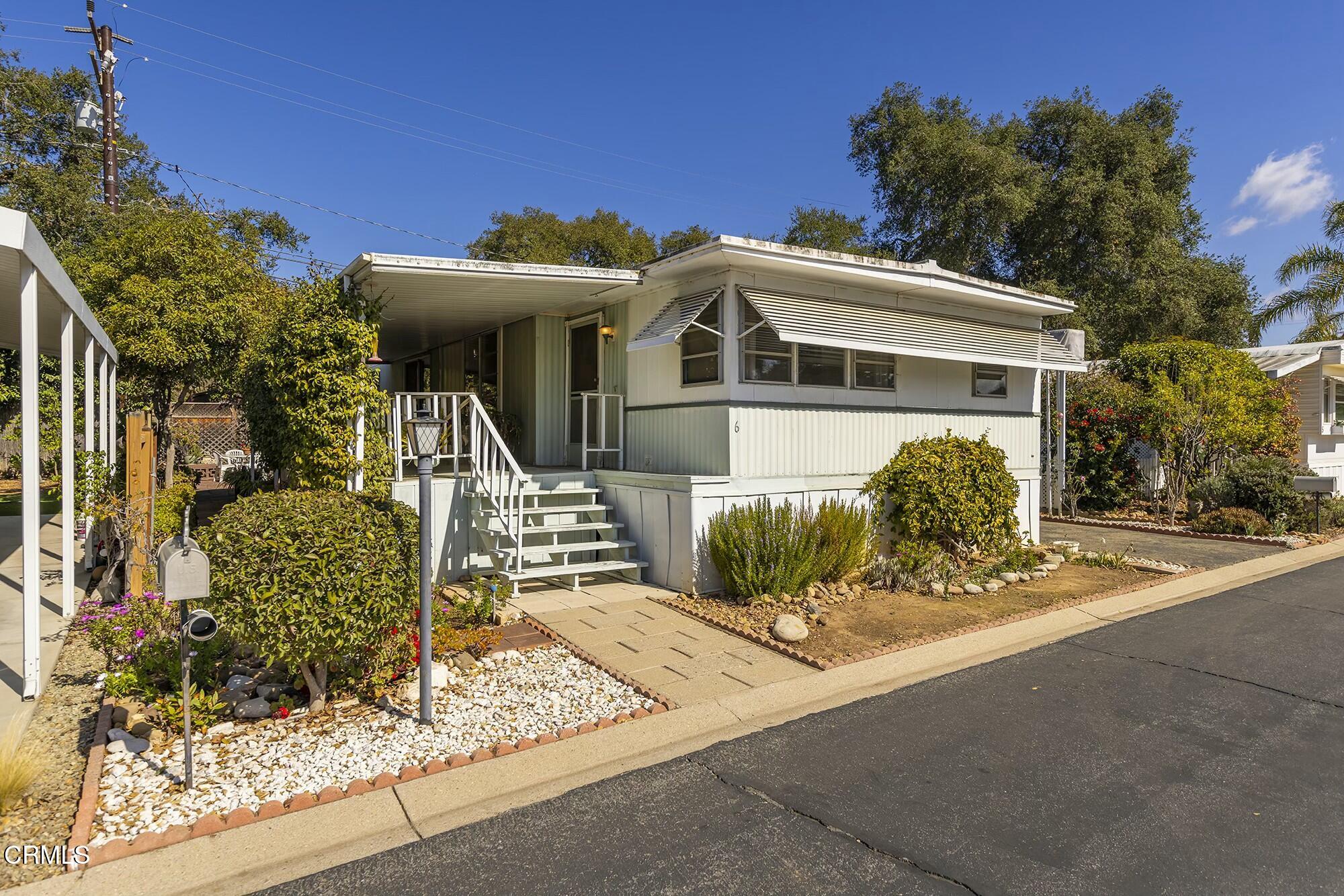 1225 South Rice Road, Unit 6 Ojai, CA 93023 - Photo 1 of 21 a front view of a house with a yard