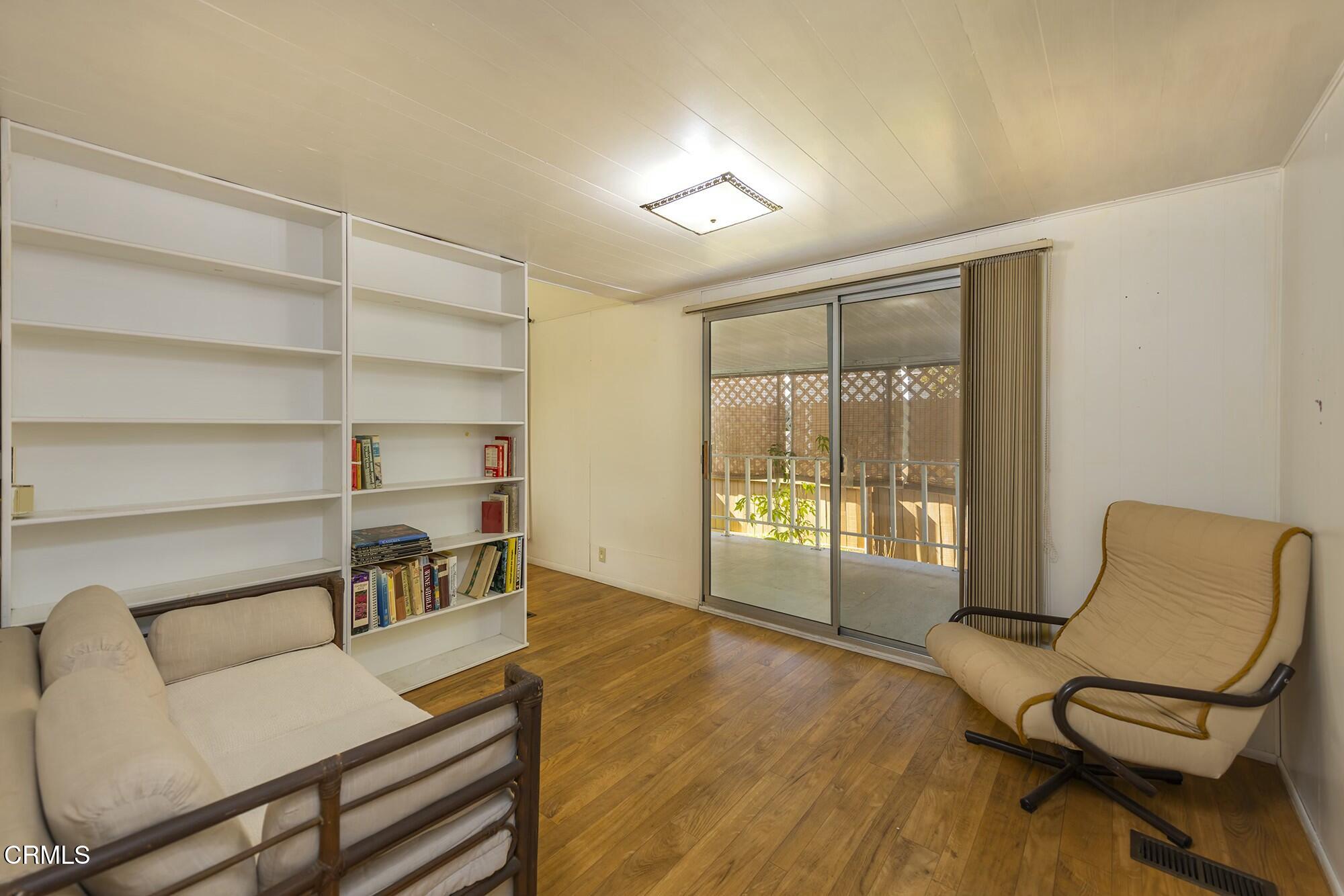 1225 South Rice Road, Unit 6 Ojai, CA 93023 - Photo 11 of 21 a living room with furniture and a floor to ceiling window