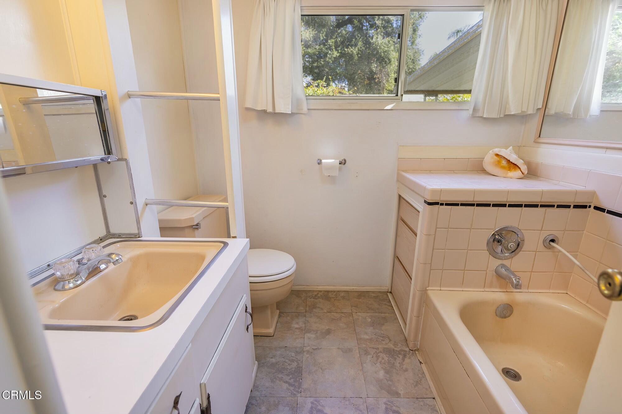1225 South Rice Road, Unit 6 Ojai, CA 93023 - Photo 14 of 21 a bathroom with a sink a bathtub and a toilet