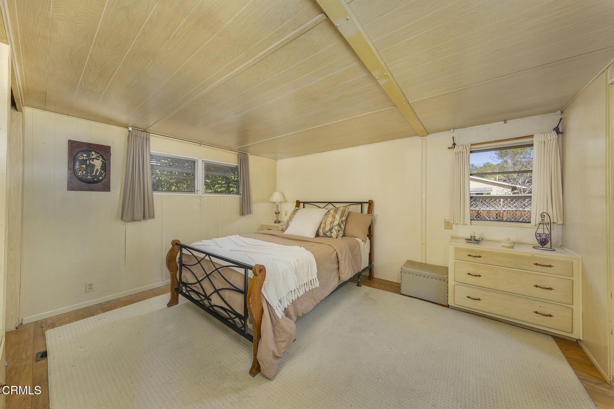 1225 South Rice Road, Unit 6 Ojai, CA 93023 - Photo 15 of 21 a spacious bedroom with a bed and a window
