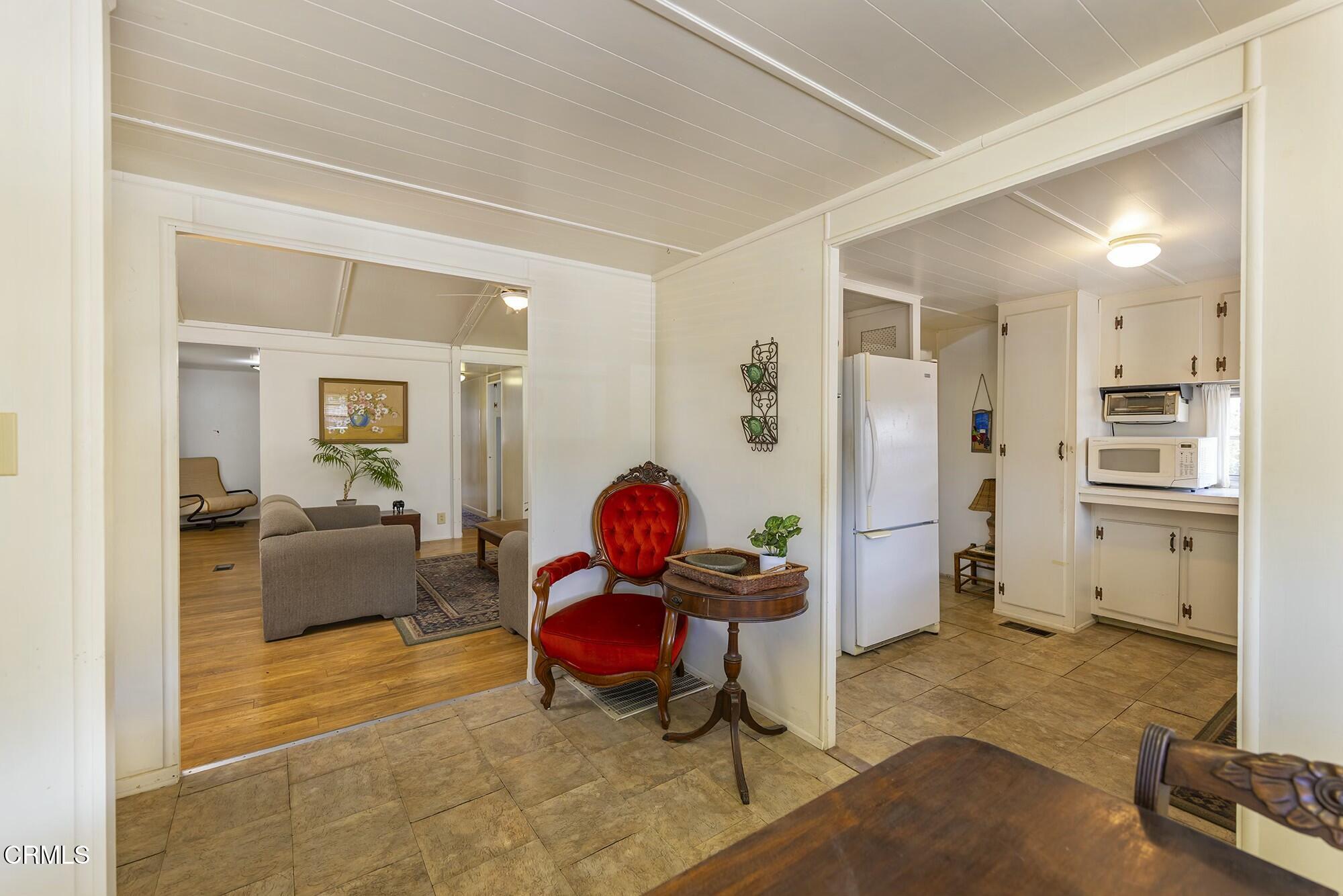 1225 South Rice Road, Unit 6 Ojai, CA 93023 - Photo 6 of 21 a living room with furniture and a flat screen tv